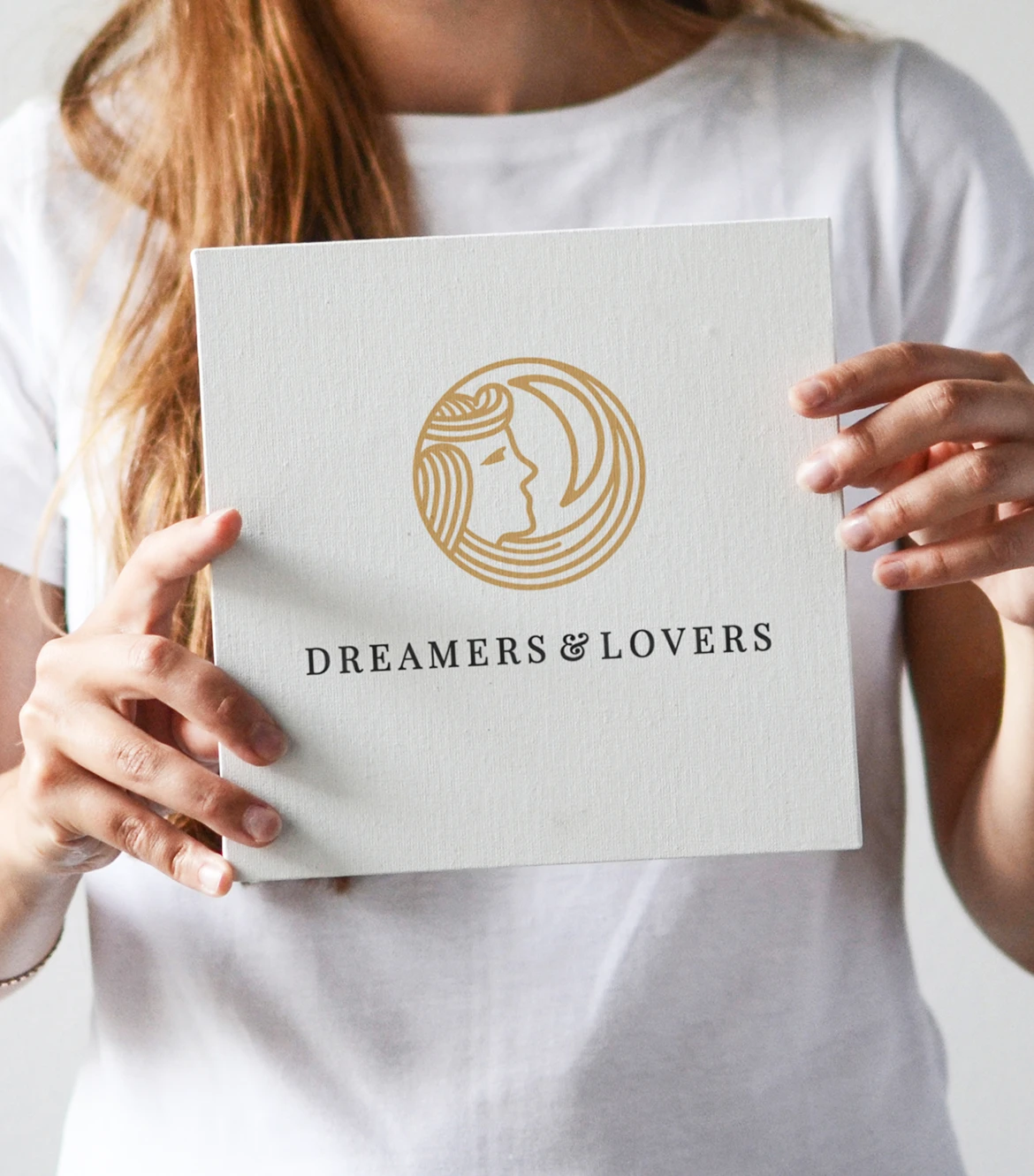 Dreamers and Lovers sign held by female model