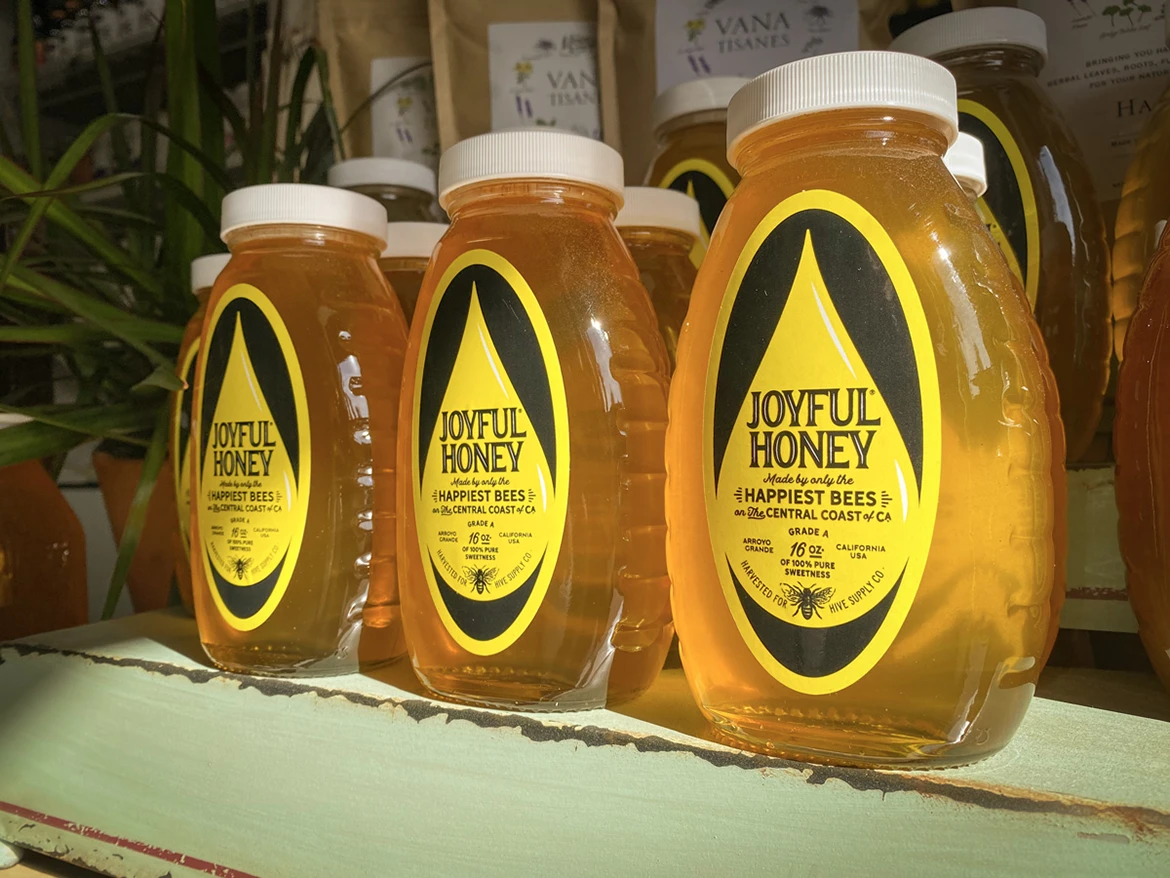 Joyful Honey jars on a shelf